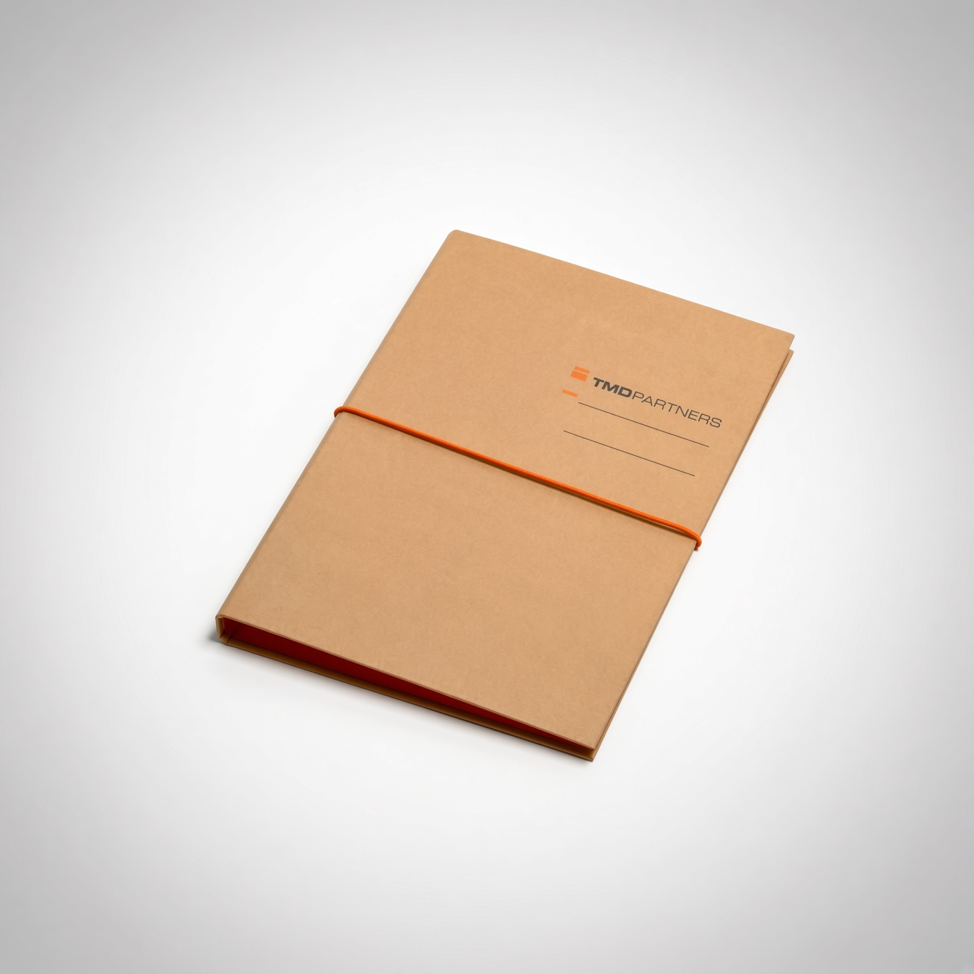 Orange rigid folder with an elastic band closure