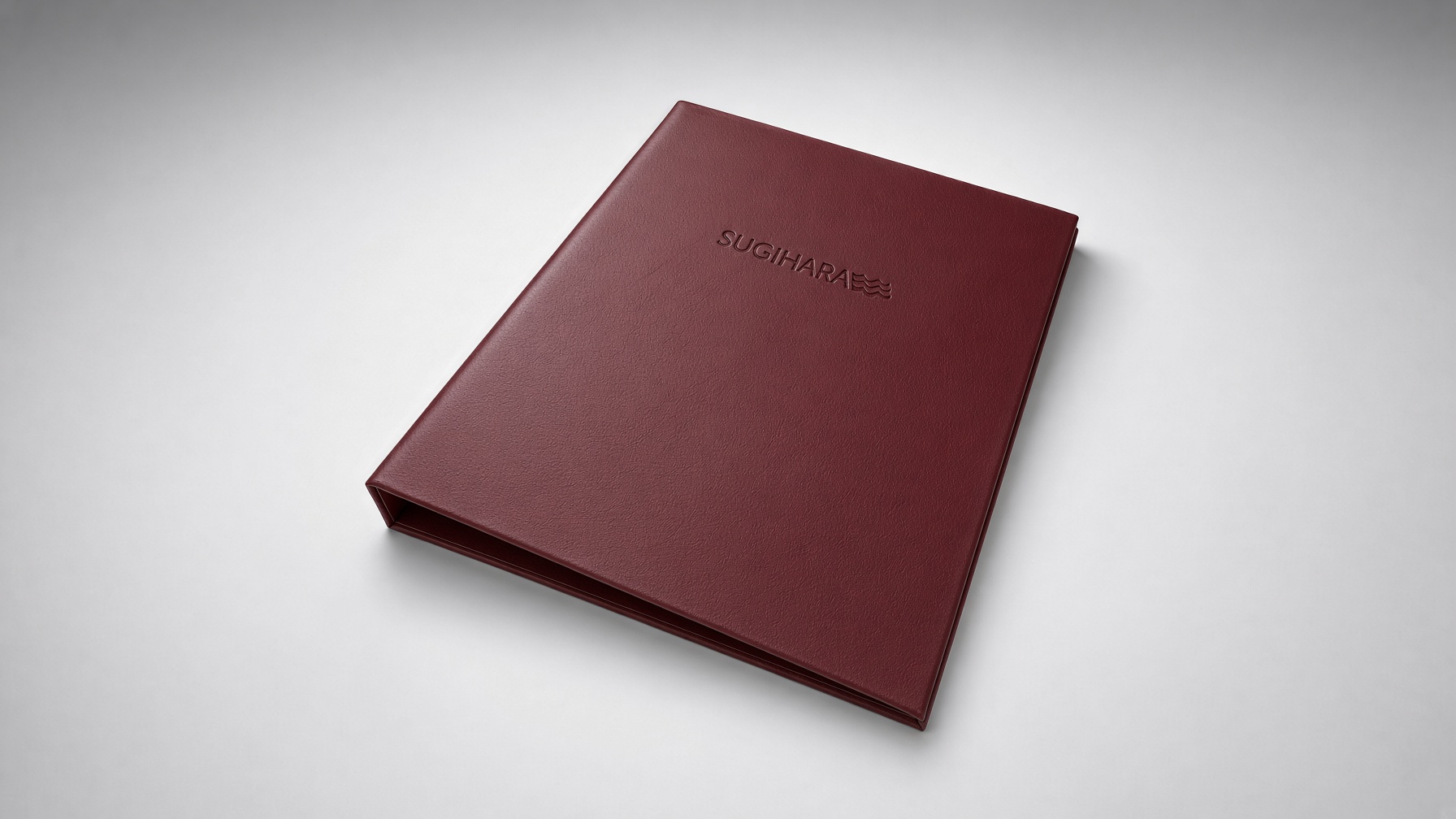 Burgundy leather-look ring binder with a debossed logo