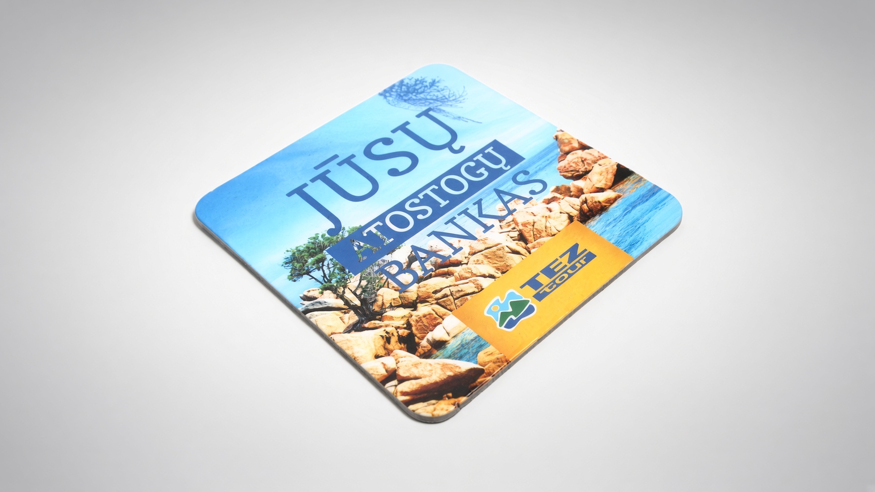 Full-colour square coaster with rounded corners and a travel agency advert
