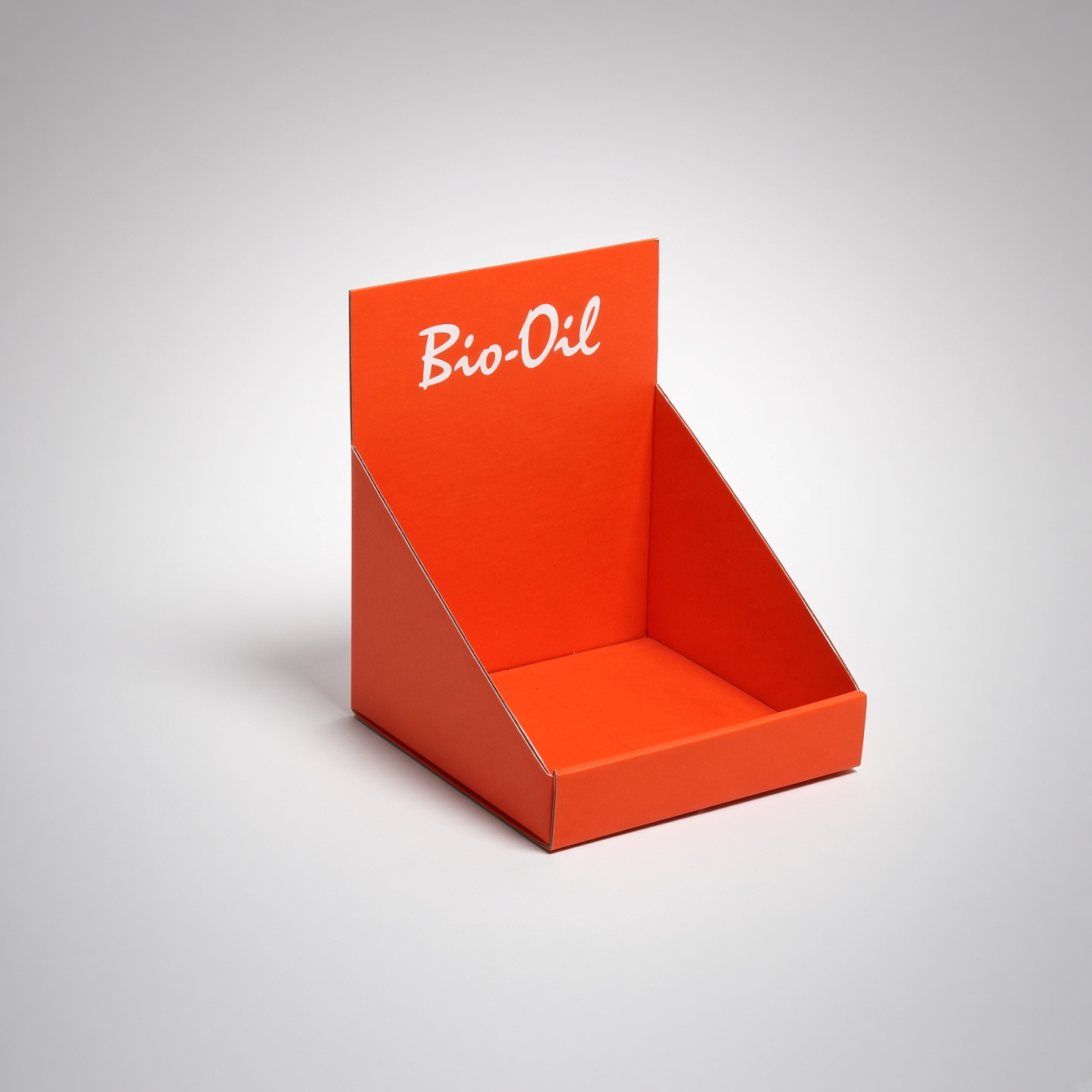 Orange cardboard counter display with a white logo